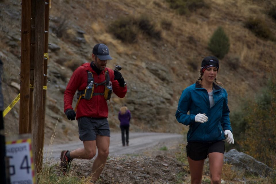 Chelsea Hathaway running into the Temple fork aid station with pacer Aaron Williams at the 2016 Bear 100