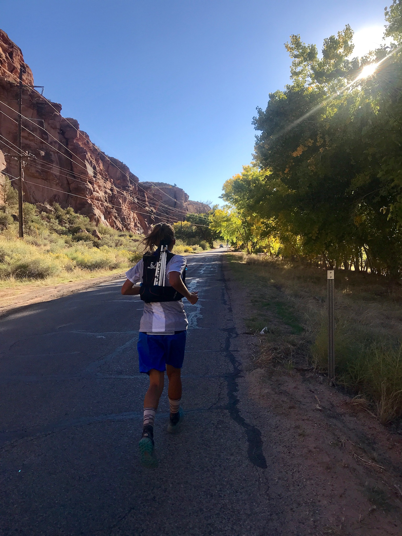 Courtney Dauwalter running a road in the Moab 200