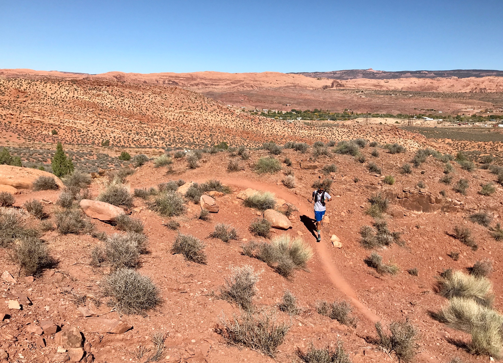 Courtney Dauwalter running through the desert in the Moab 200